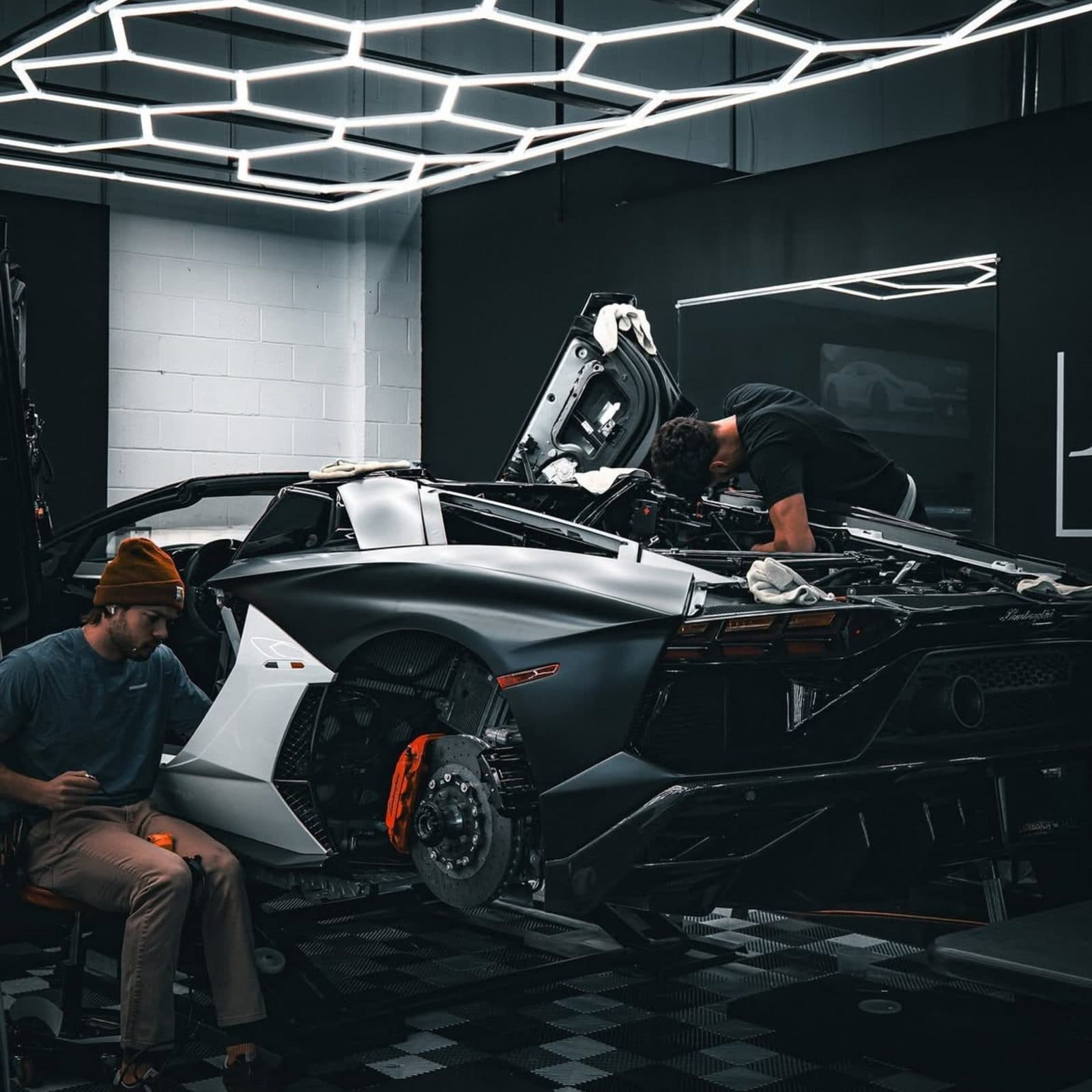 Paintwork inspected under the studio light rig before any product is applied