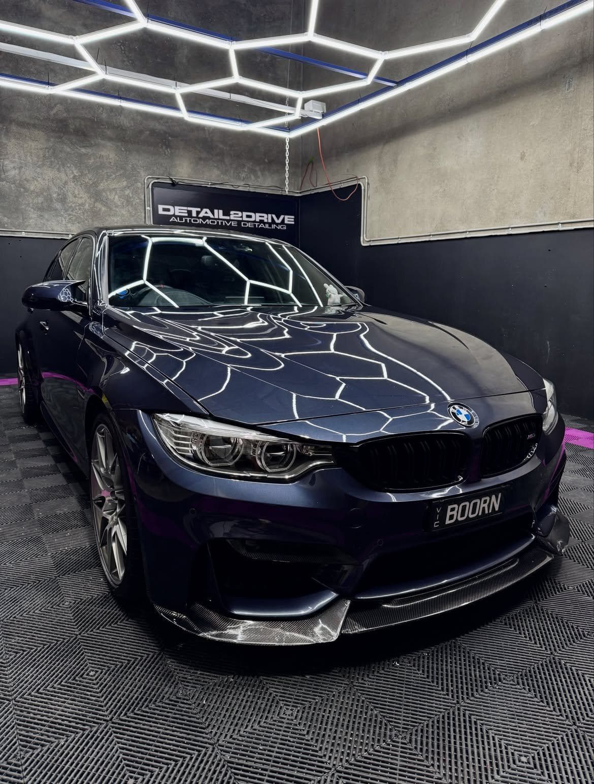 Dark blue BMW M3 finished under the light rig at the Detail 2 Drive studio in Pakenham