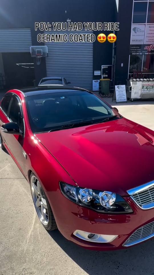 Red Ford Falcon and a black Mitsubishi Triton after ceramic coating